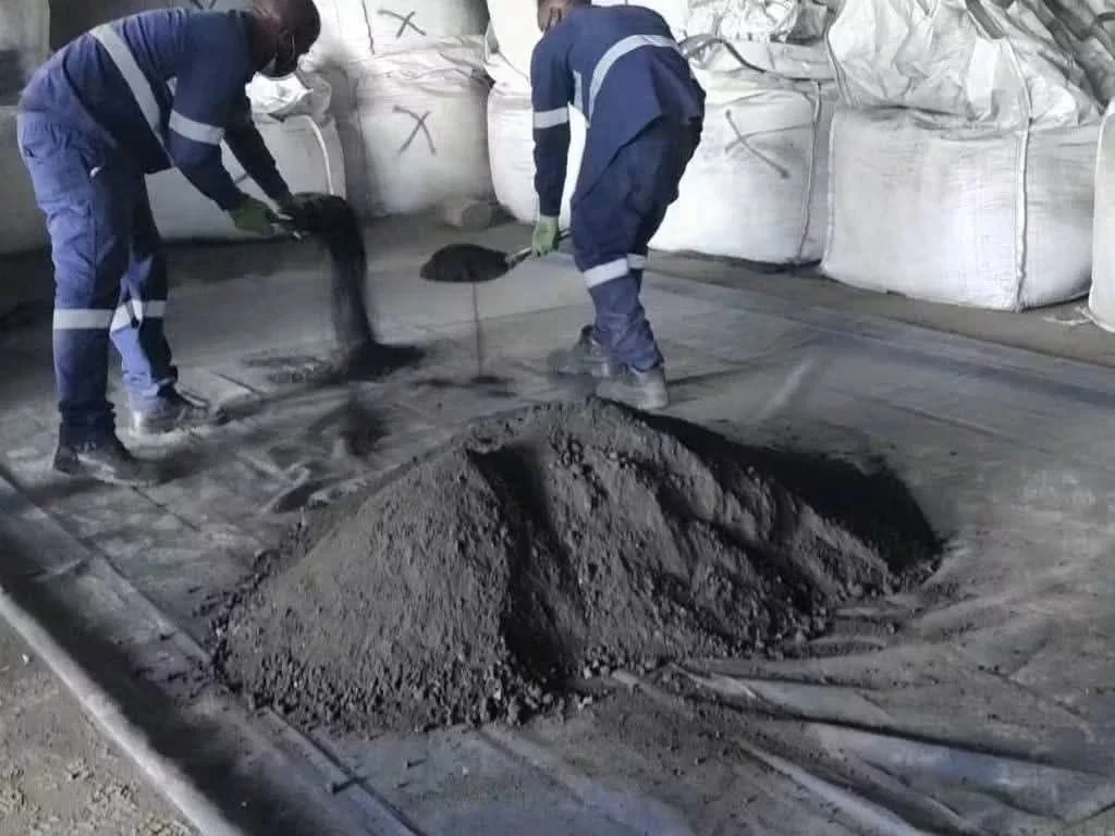 Workers handling bulk mineral material